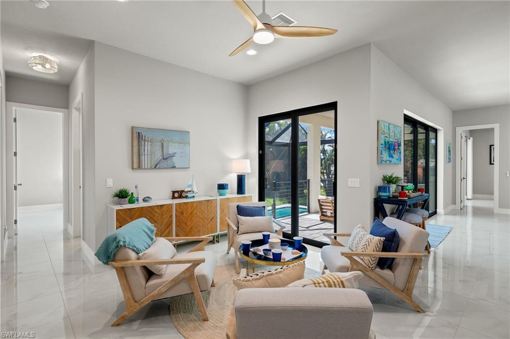 Living room featuring ceiling fan