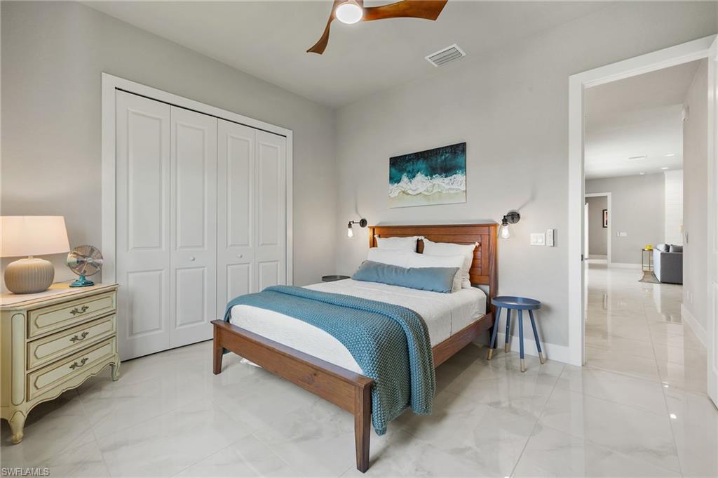 Bedroom with a closet and ceiling fan
