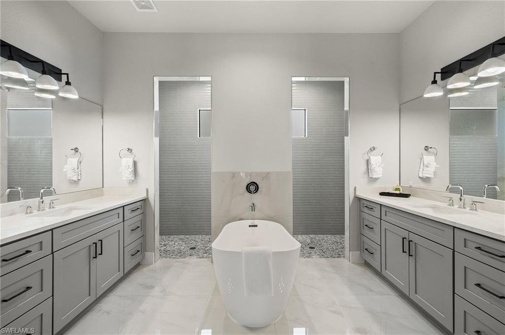Bathroom with vanity and independent shower and bath