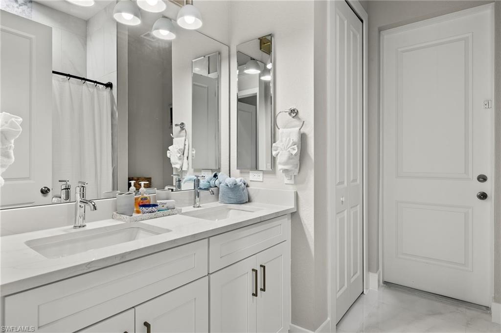 Bathroom featuring vanity and a shower with shower curtain