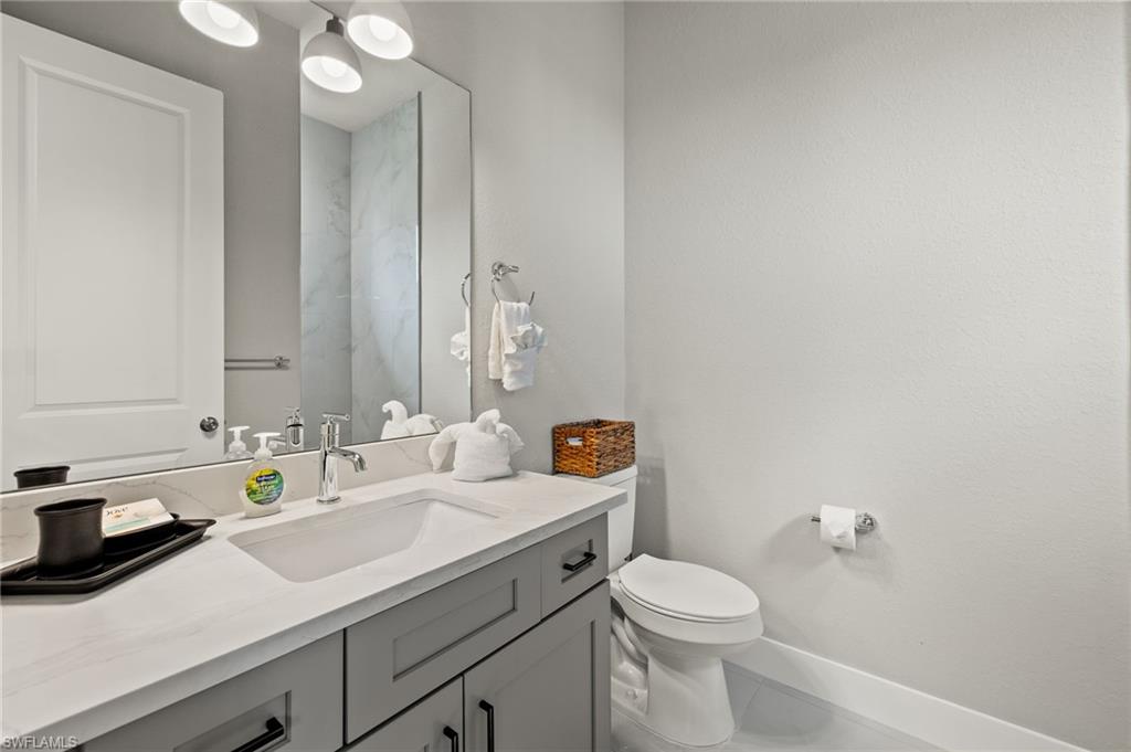 Bathroom featuring vanity and toilet