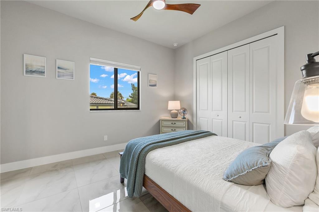 Bedroom featuring a closet and ceiling fan