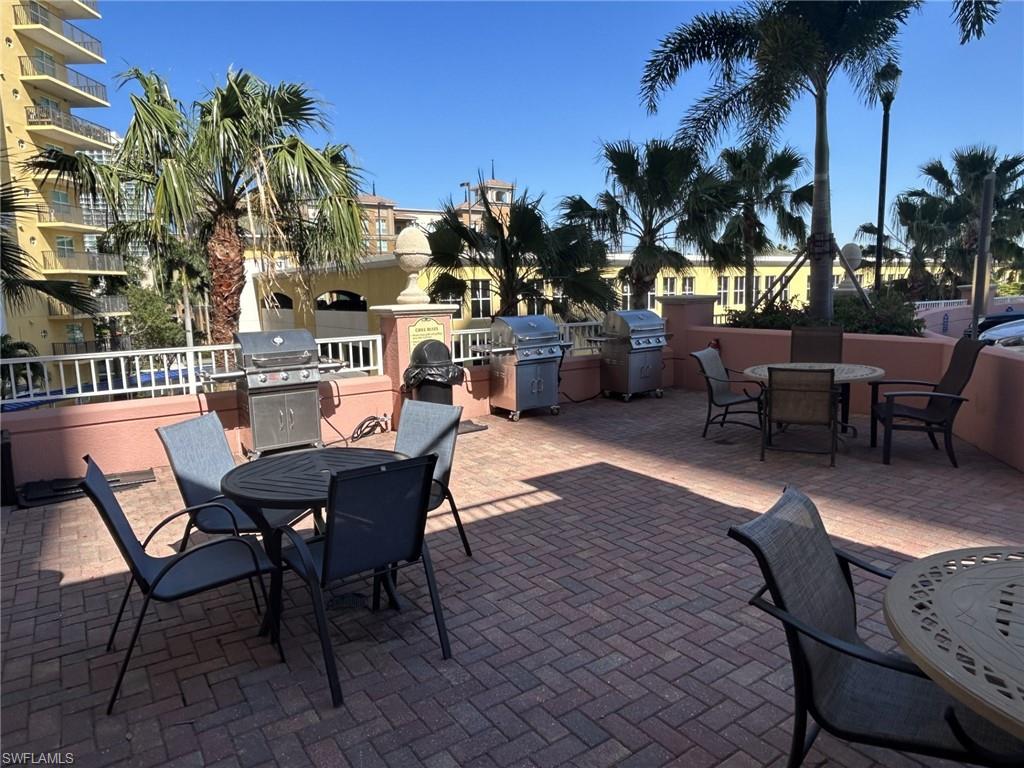 Patio with gas grills provided by complex
