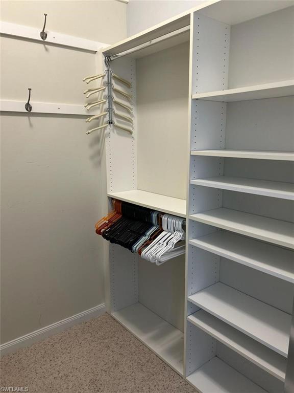 Primary bedroom walk in closet