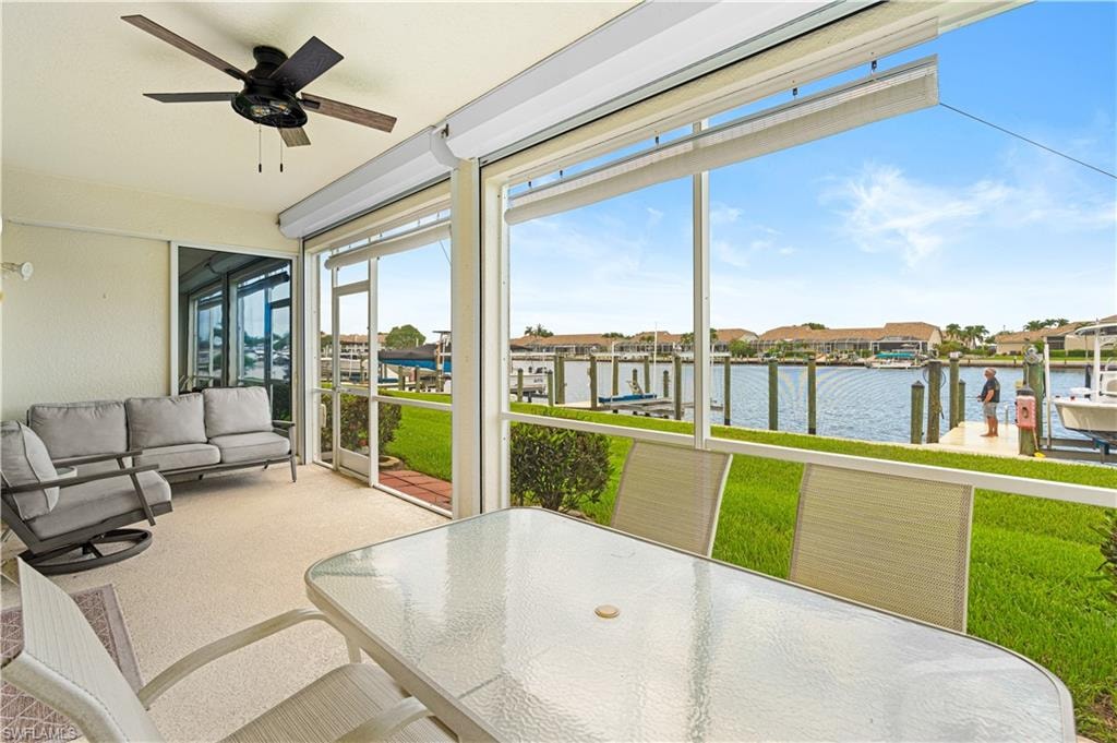 Screened lanai with ceiling fan and waterside exposure