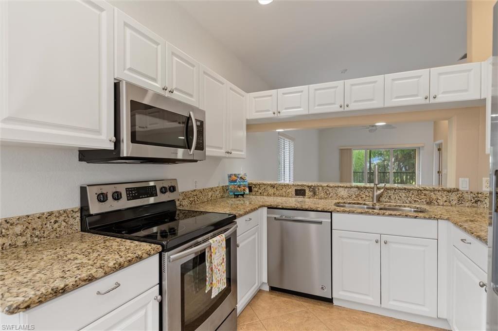 Kitchen has granite and stainless
