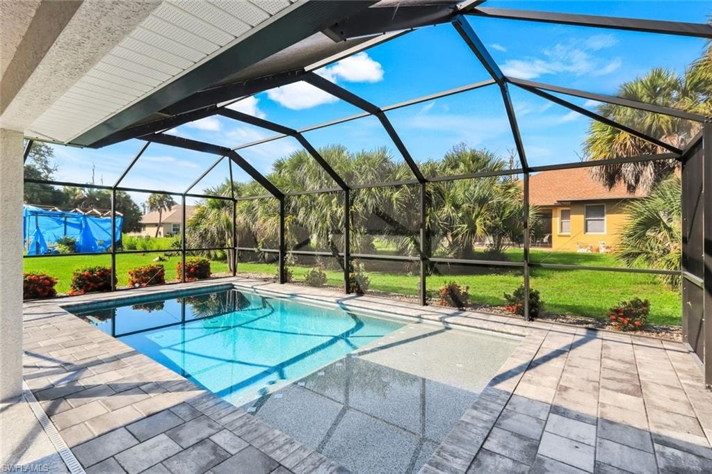 View of the pool and yard