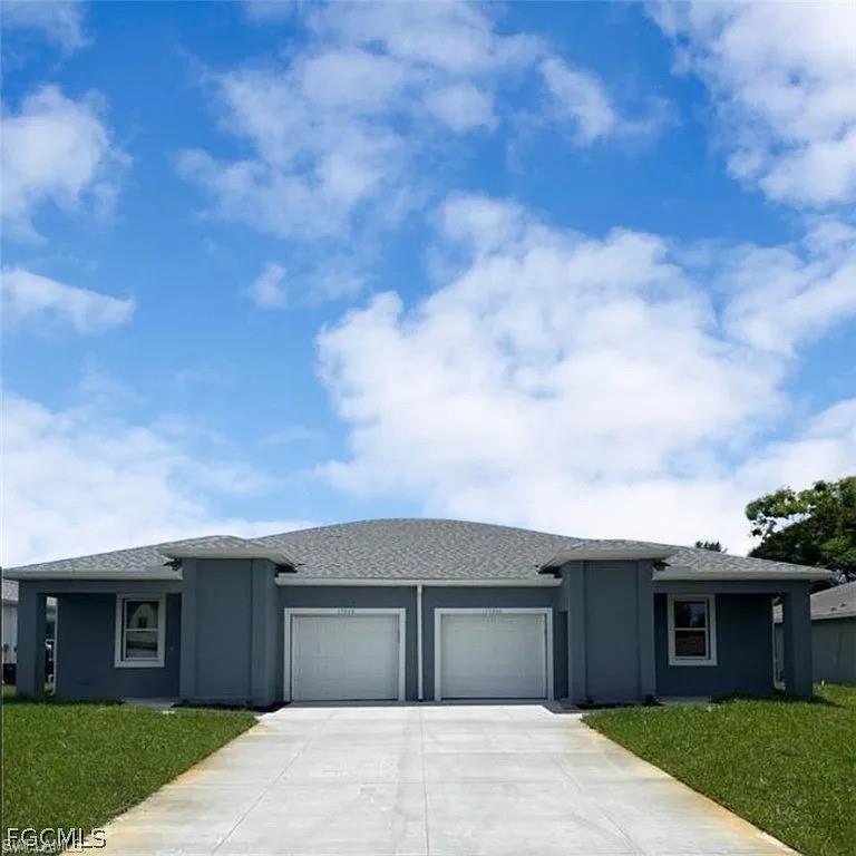 Duplex property featuring a neutral exterior paint finish, two single-car garage doors, a paved driveway, and a shingled roof