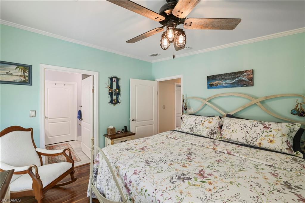 Recessed lighting and a ceiling fan with integrated lighting illuminate this space