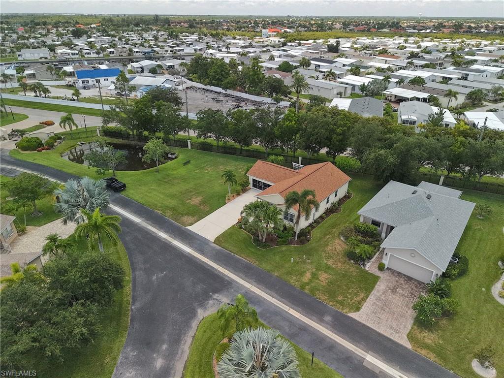 Single-story residence featuring an attached garage and a concrete driveway