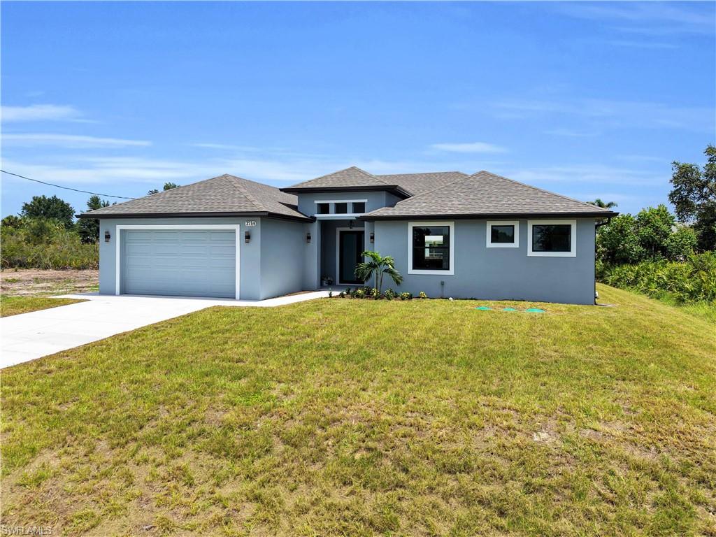 Contemporary-style exterior with a light blue stucco finish