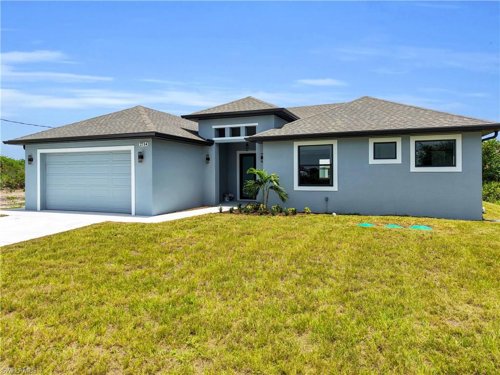 Contemporary stucco exterior with a gray palette and dark trim