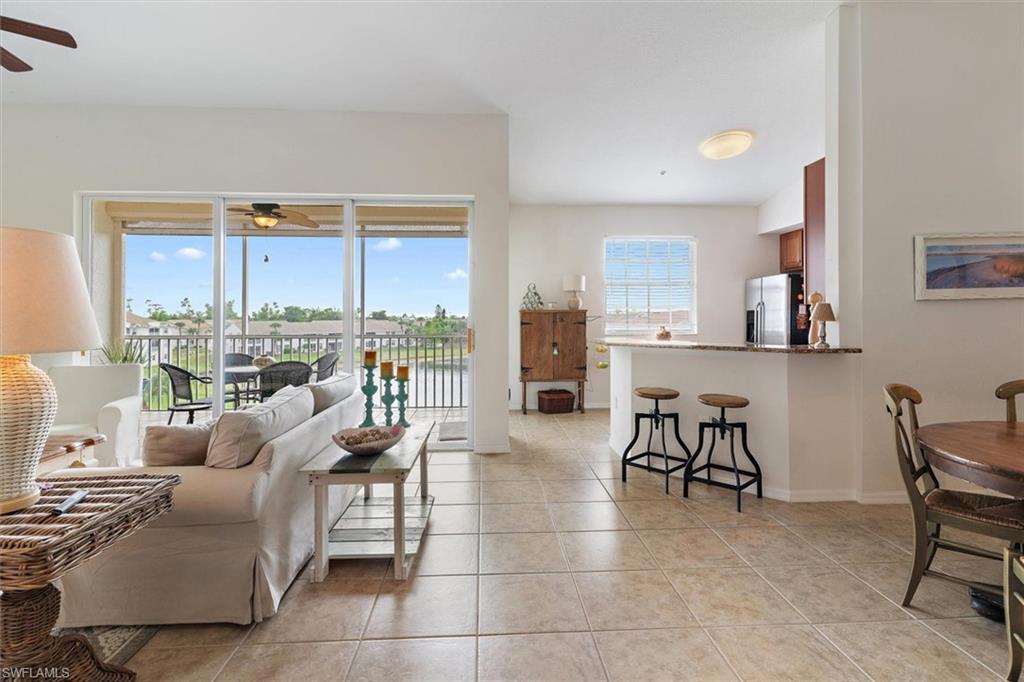 Open-concept living space with large format tile flooring throughout