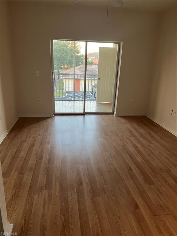 Empty room featuring light wood-style flooring and ceiling fan