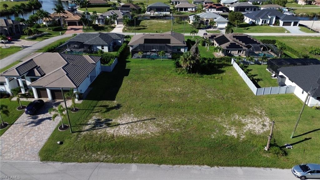 Expansive grass lot with surrounding paved street access