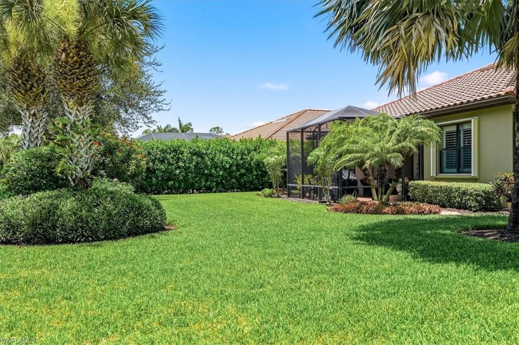 Expansive green lawn with mature landscaping