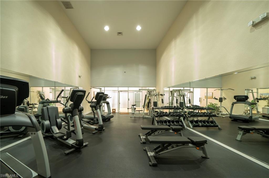 Workout area featuring a high ceiling