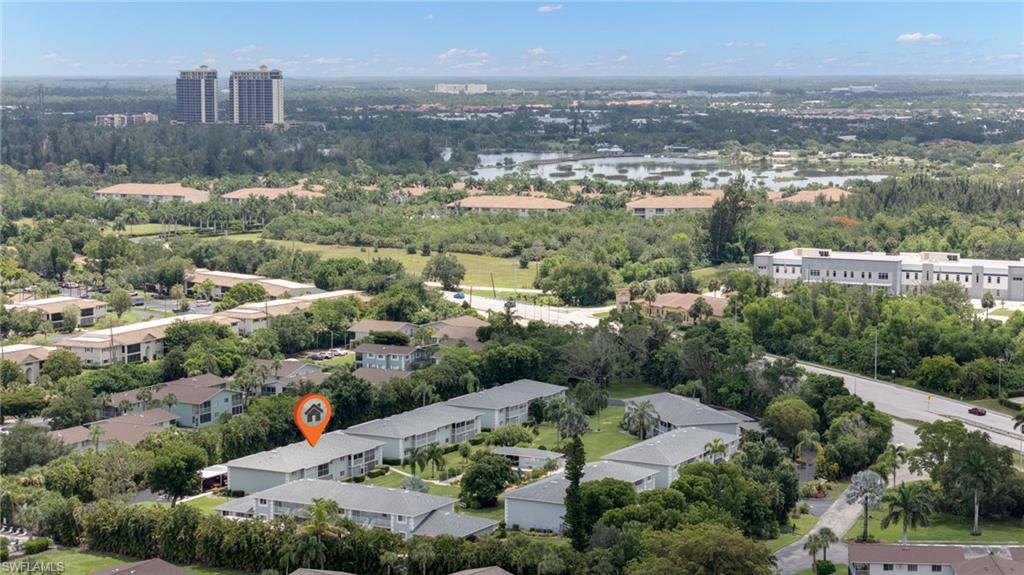 Aerial perspective showcasing multiple residential buildings within a community setting