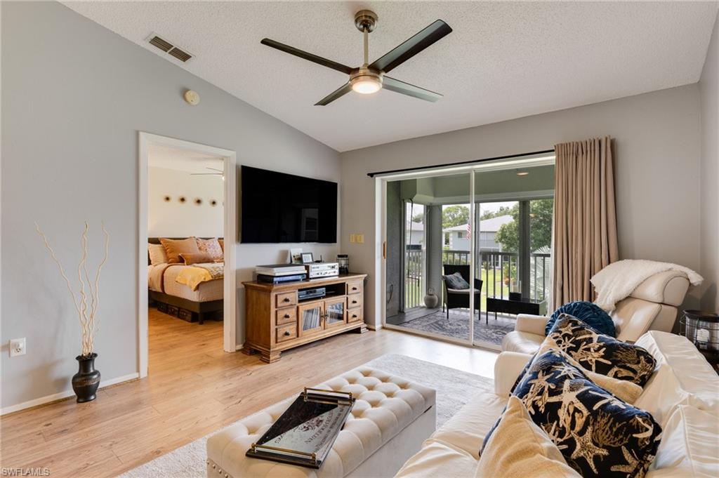 Vaulted ceiling featuring a ceiling fan with integrated lighting