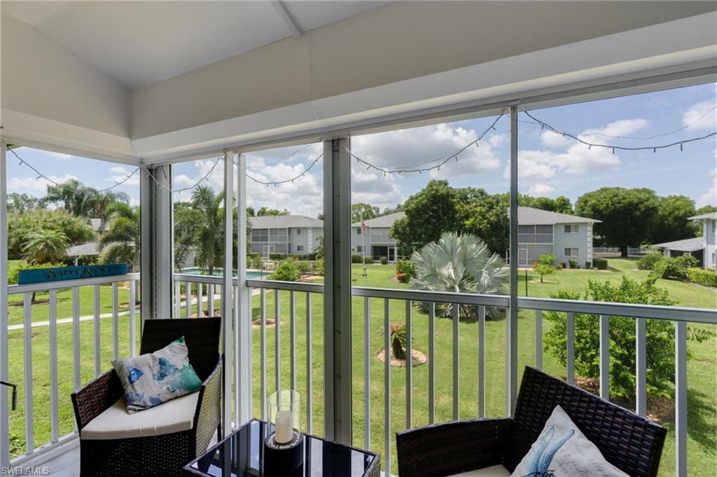 Screened back patio with electric hurricane shutter