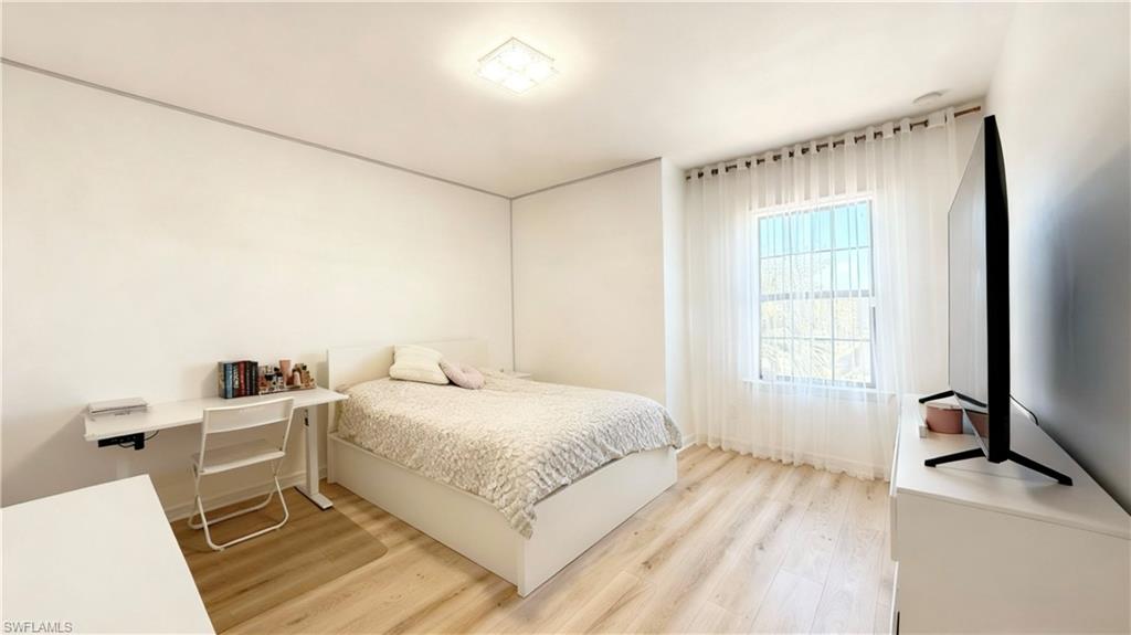 Bedroom with light wood finished floors