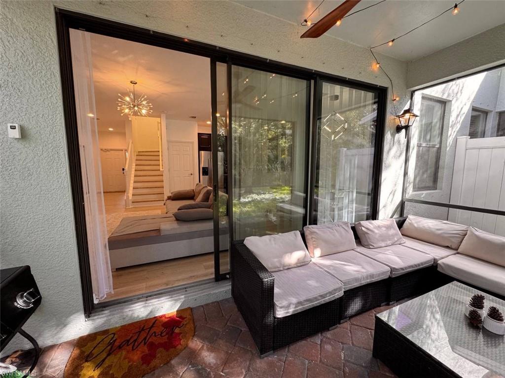 Sunroom featuring a chandelier