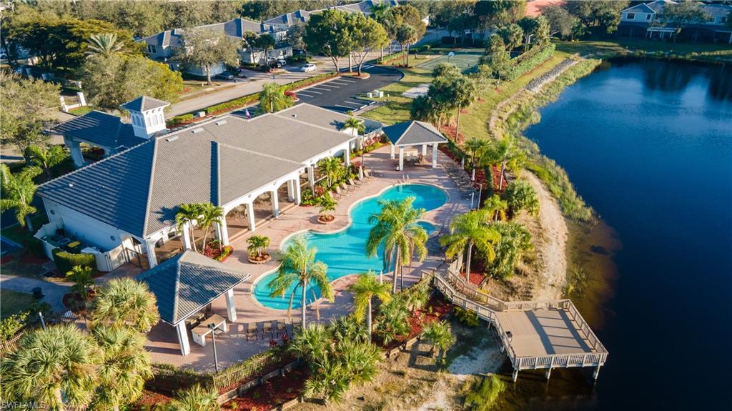 Drone / aerial view of a large body of water and a pool area
