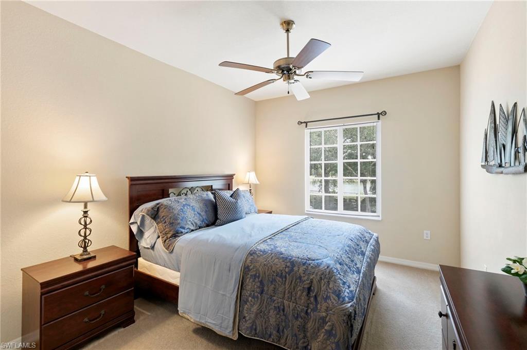 Guest bedroom number two with large walk in closet and lake view.