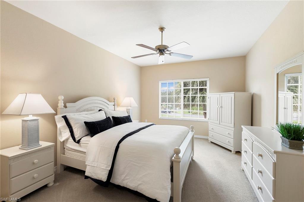 Bright and airy primary suite features ensuite bath and walk in closets.