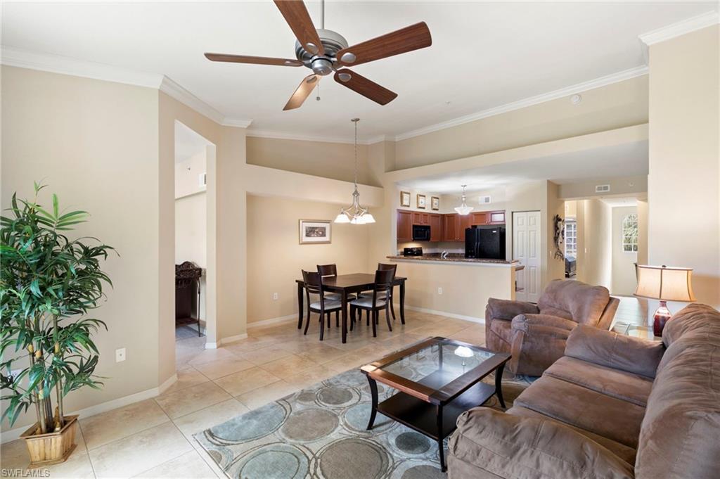 Expansive split floor plan living and dining area with vaulted ceilings.
