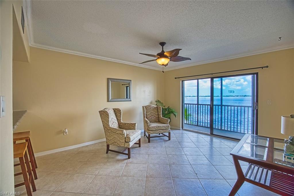 Second living area off the kitchen. sliders open to the large lanai, an expansive river veiw