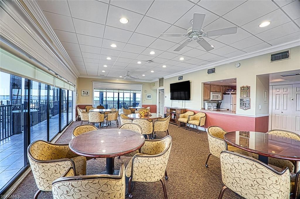 Community room with river views, pass through kitchen, tv - great for game night or parties.
