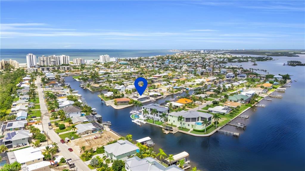 Boaters dream location - Birds eye view of property with a water view, with the Gulf Of VIRTUALLY ENHANCED - Mexico in the background