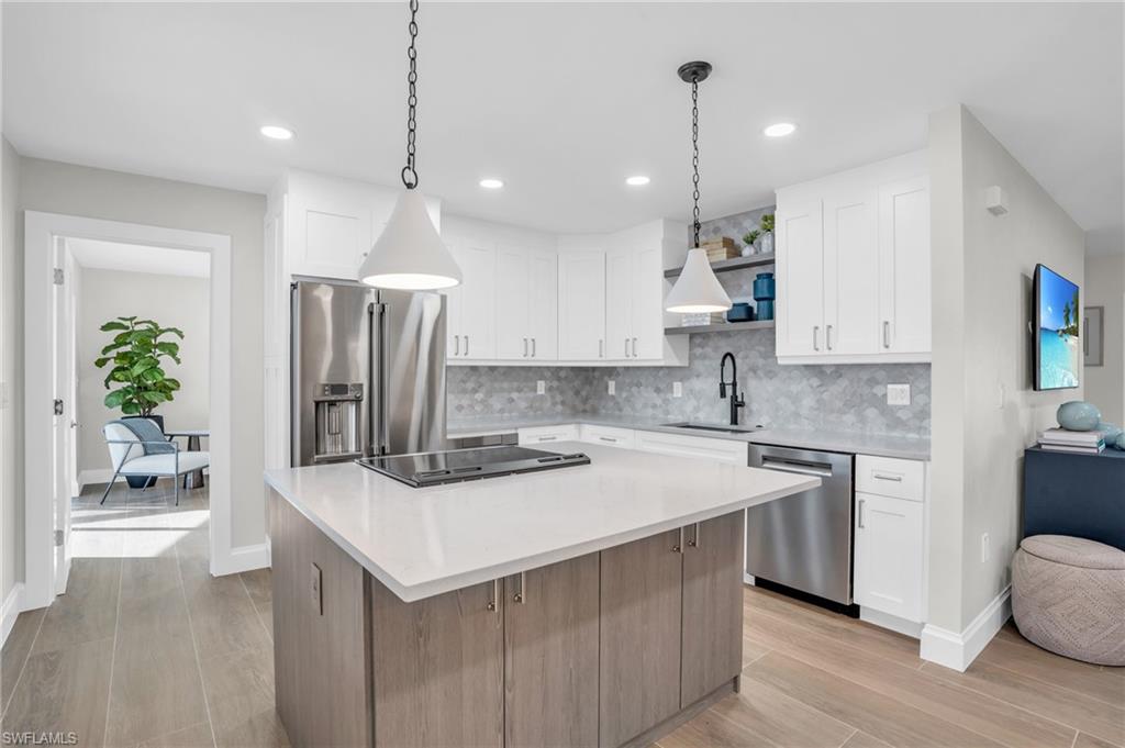 Wow! It feels like a model home with all the latest in kitchens.  Large Island for hanging out and the latest upgrades in appliances and cabinetry