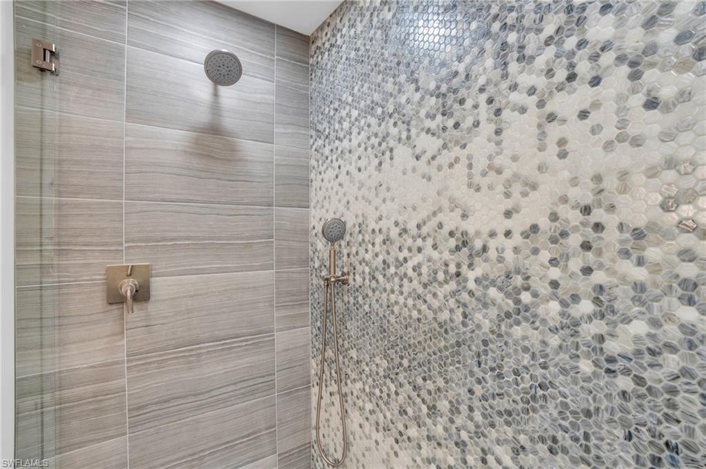Wow! You may never want to get out of this designer shower in the Primary bathroom!
