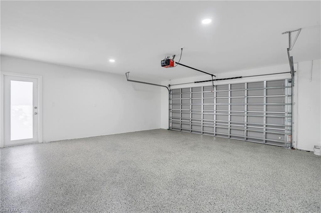 Two car garage with the Hurricane garage door and Epoxy garage floor.