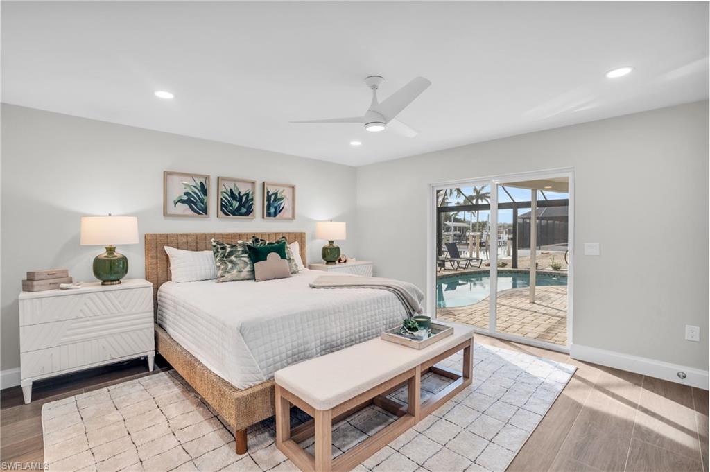 Guest Suite feels like a Primary Bedroom as well.  Sliders out to the pool/lanai with so much natural light