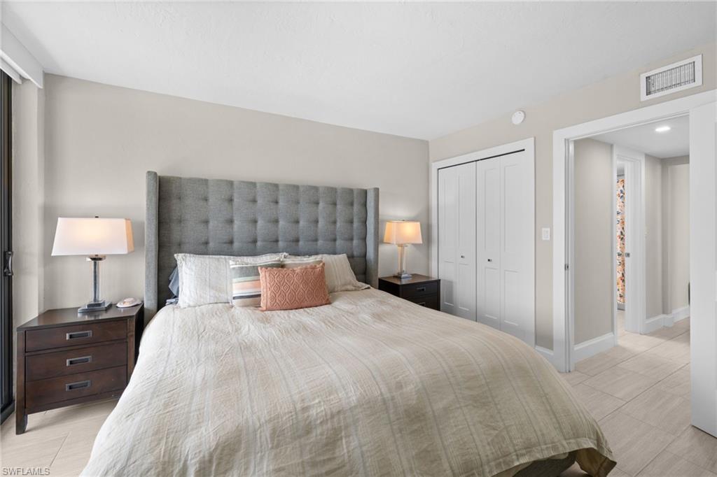 Interior room featuring neutral wall tones, light wood-finish flooring, and white trim