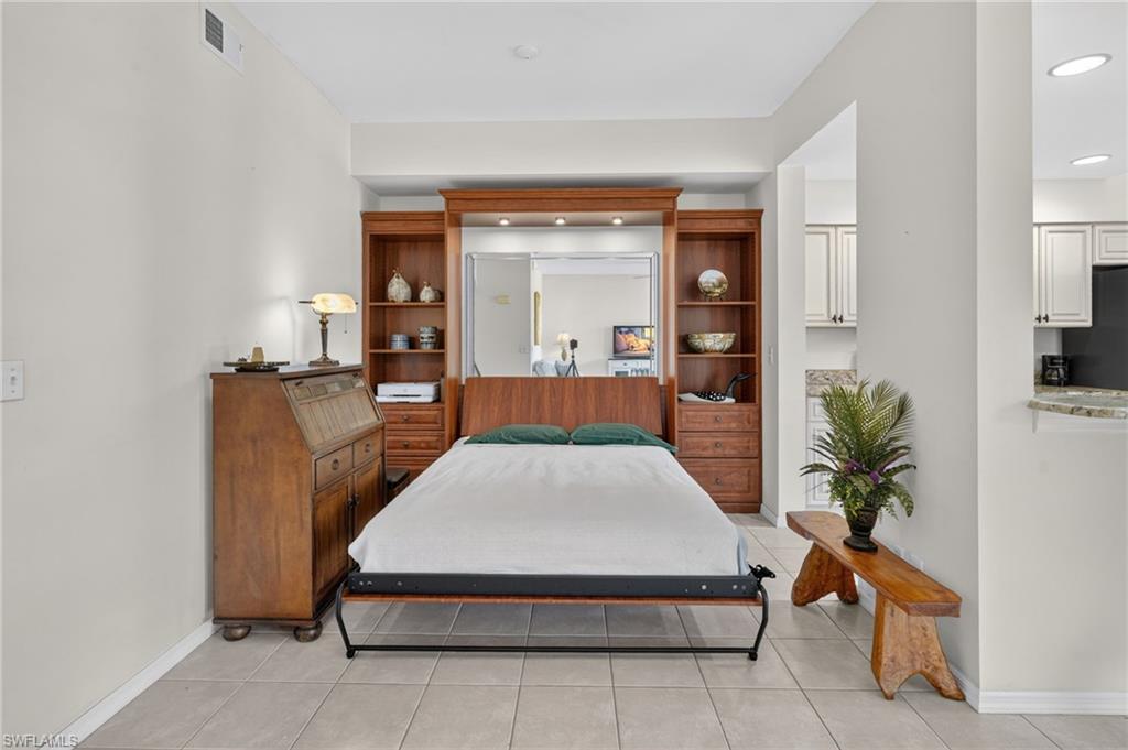 Integrated wall bed system with built-in shelving, drawers, and task lighting