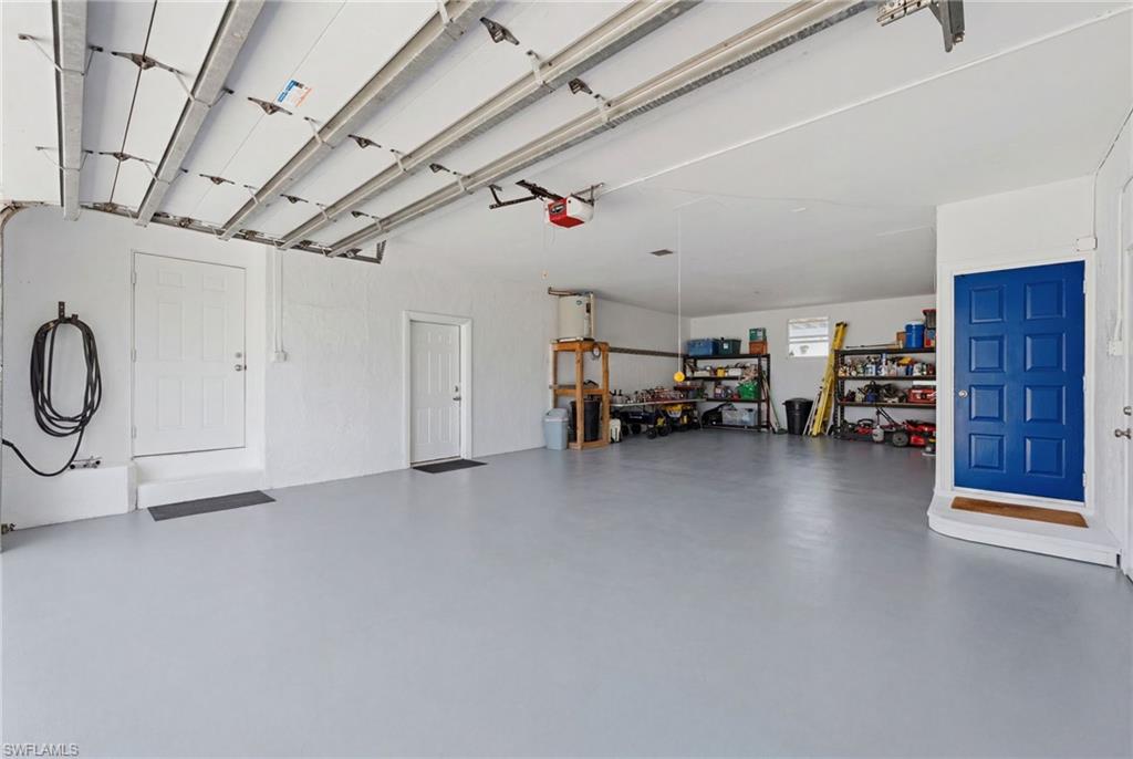 Four car garage with plenty of space for golf carts, jet skis, etc