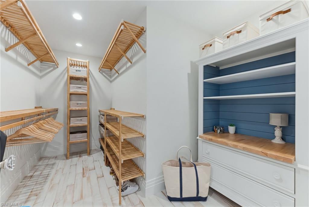 Primary walk in closet with ample storage