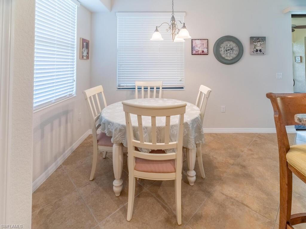 Dining area featuring a chandelier and light tile patterned floors