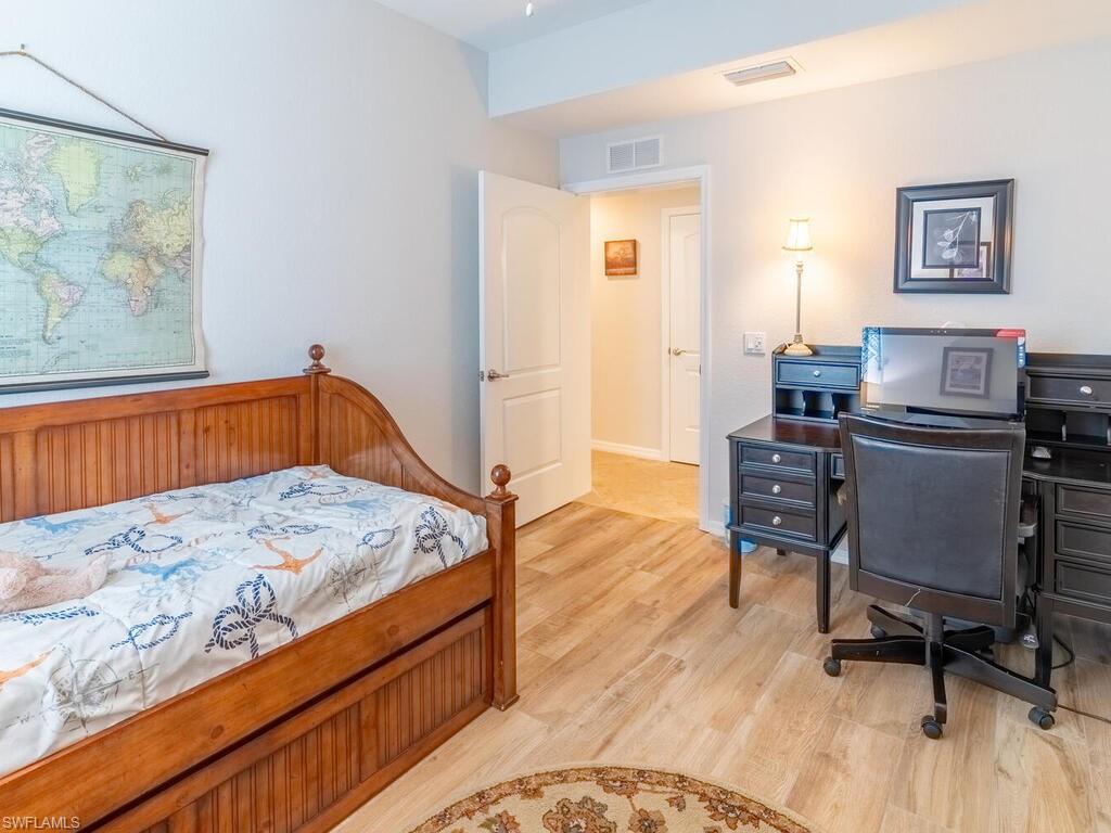 Bedroom with light hardwood / wood-style flooring