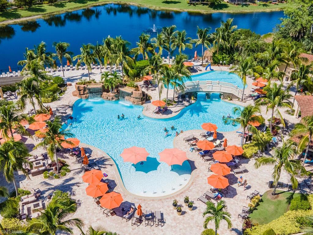 View of pool with a water view and a patio area