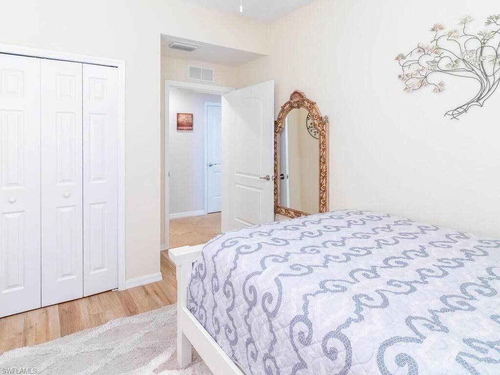 Bedroom featuring a closet and light hardwood / wood-style floors