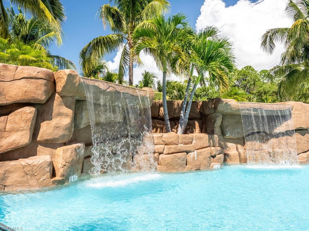 View of swimming pool with pool water feature