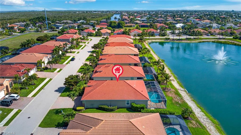 Aerial perspective showcasing a residential development with water features