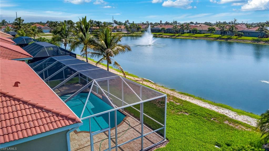 Screened lanai featuring a swimming pool with paver decking