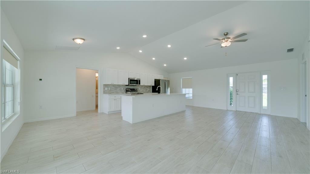Great Room, Dining Room, and Kitchen with plenty of light
