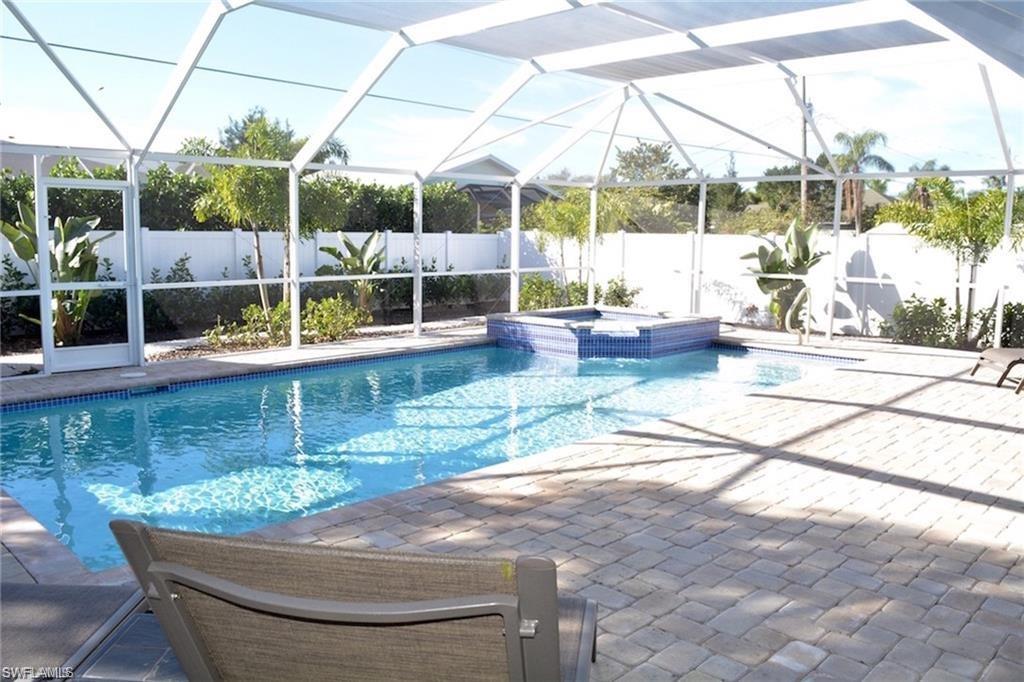 Fantastic Privacy! Pool is screened in and fenced with beautiful vinyl fencing and mature tropical landscaping.